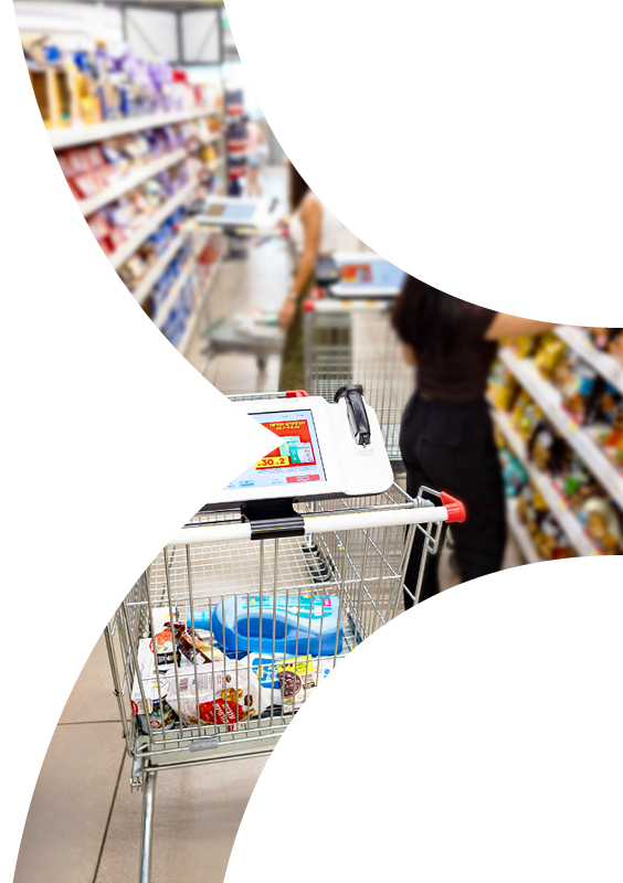 Shopping trolley in supermarket aisle